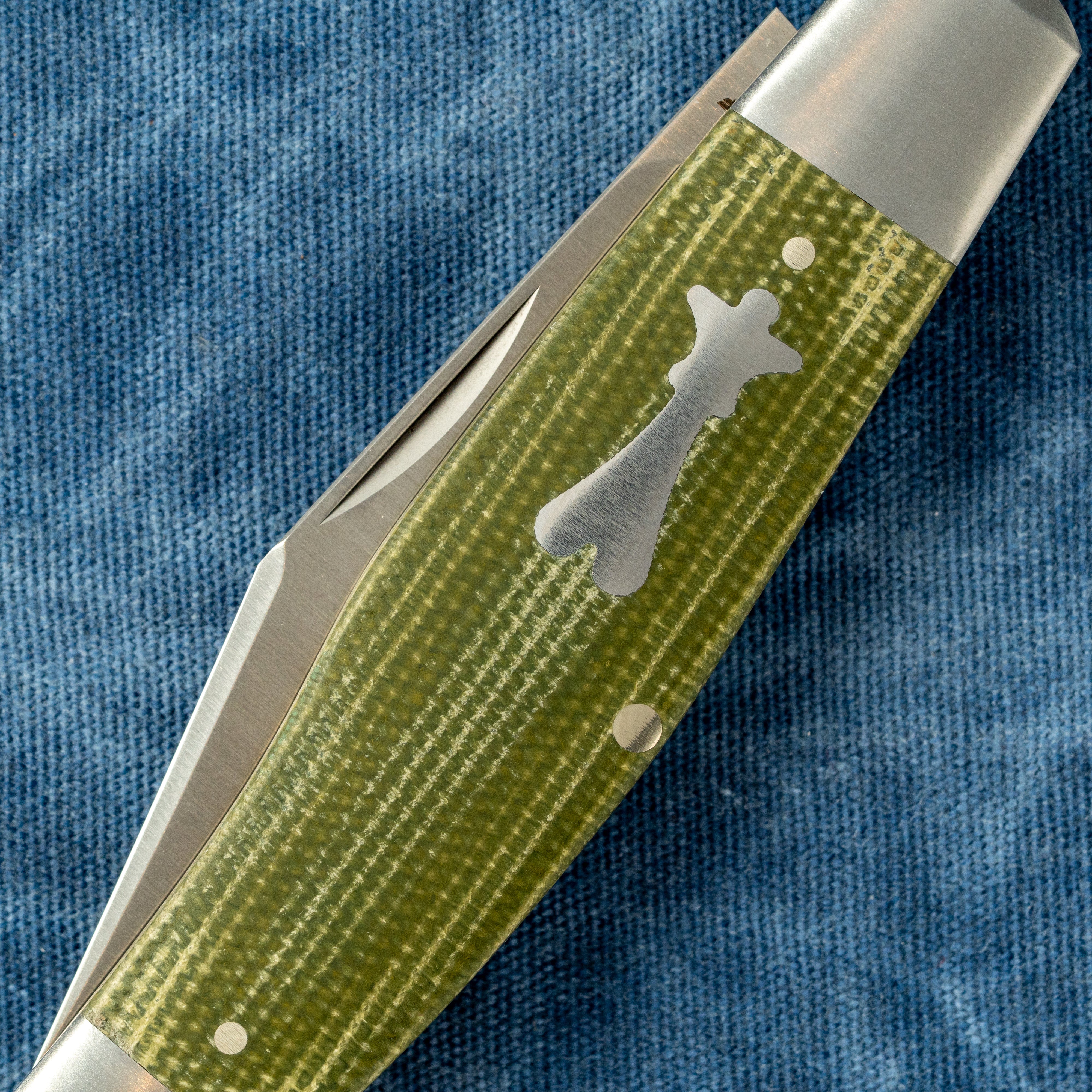 STOCKMAN - GREEN CANVAS MICARTA