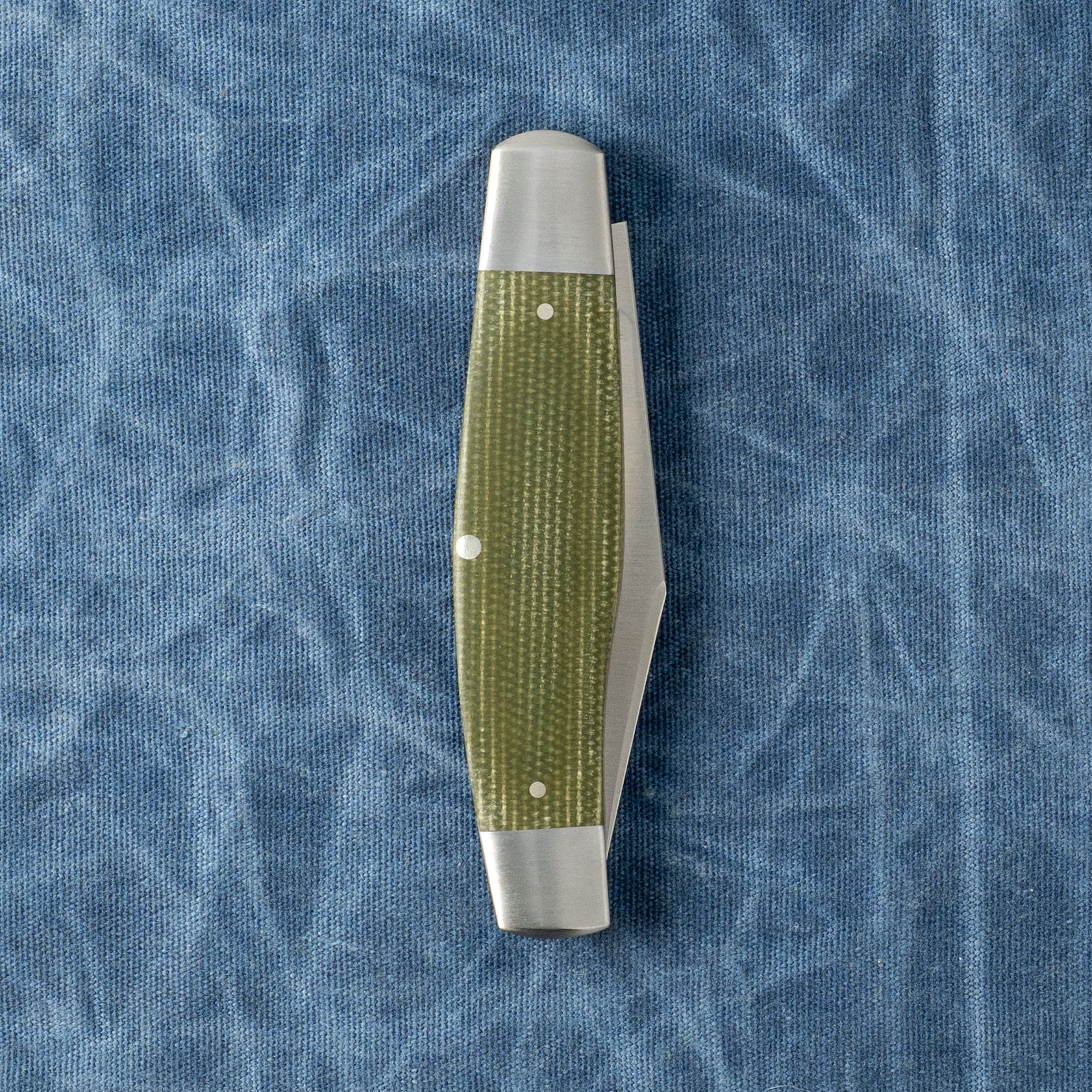 STOCKMAN - GREEN CANVAS MICARTA